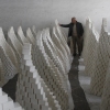 Ahmad Dwikat, a Palestinian worker, inspects bars of soap stacked to dry before packing them at a soap factory in the West Bank city of Nablus, on March 1.
