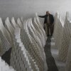 Ahmad Dwikat, a Palestinian worker, inspects bars of soap stacked to dry before packing them at a soap factory in the West Bank city of Nablus, on March 1.
