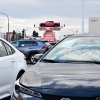 A pickup truck is raised for display at a car dealership in Alhambra, California, on March 27, 2025. After President Trump announced significant tariffs on imported vehicles and parts, automaker stocks fell sharply. But sales at dealerships rose, at least in the short-term, as buyers try to get ahead of the anticipated price spikes in the coming months.