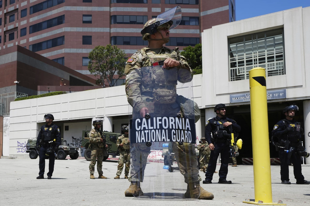 FILE - A California National Guardsmen stands to protect federal buildings, June 10, 2025, in Los Angeles.