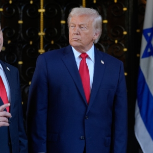 President Donald Trump listens as Israel's Prime Minister Benjamin Netanyahu speaks at President Donald Trump's Mar-a-Lago club, Dec. 29, 2025, in Palm Beach, Fla.