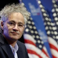 This photo shows Alex Karp, CEO of Palantir, photographed from about the shoulders up.