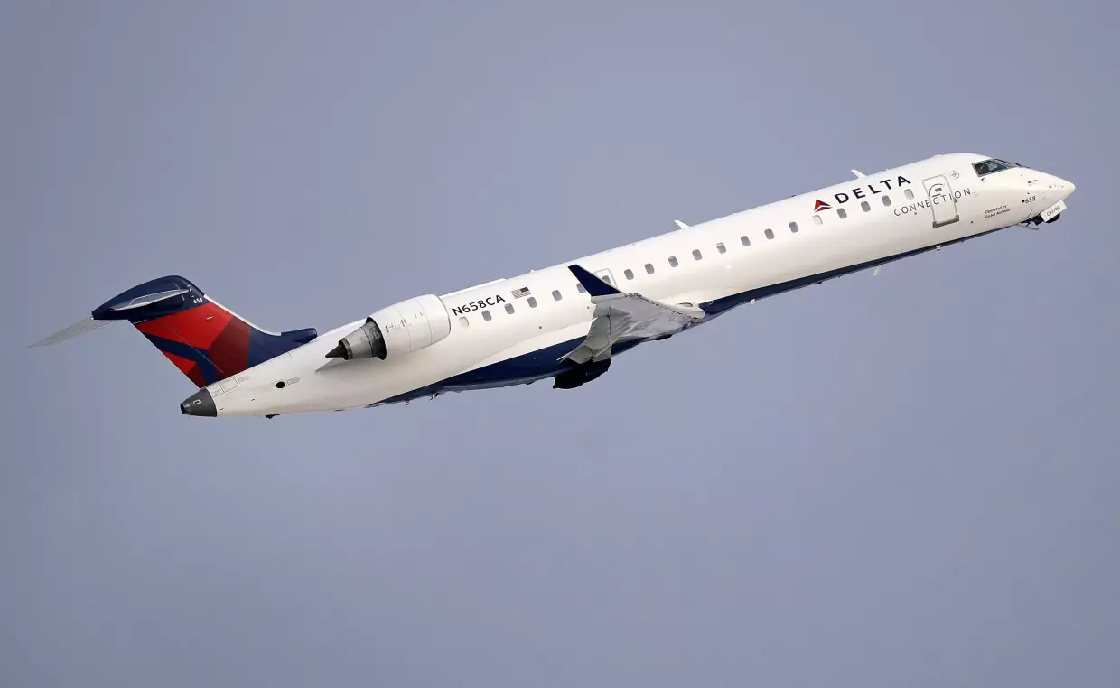 Short regional flights are the lifeblood of U.S aviation — but they were in decline even before jet fuel concerns struck. Here, a file photo shows a Delta Air Lines Connection regional jet operated by GoJet Airlines taking off from Logan International Airport in Boston.