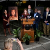Public radio journalist Catherine Sweeney, one of the media witnesses, recounts the moments before Christa Pike's execution was stopped last Wednesday, September 30. (AP Photo/George Walker IV) Next to the podium are two photos of Colleen Slemmer, Pike's victim in the 1995 murder.