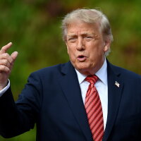 U.S. President Donald Trump reacts towards members of the media after a courtesy call with Irish President Catherine Connolly at Áras an Uachtaráin on September 12, 2026 in Dublin, Ireland.