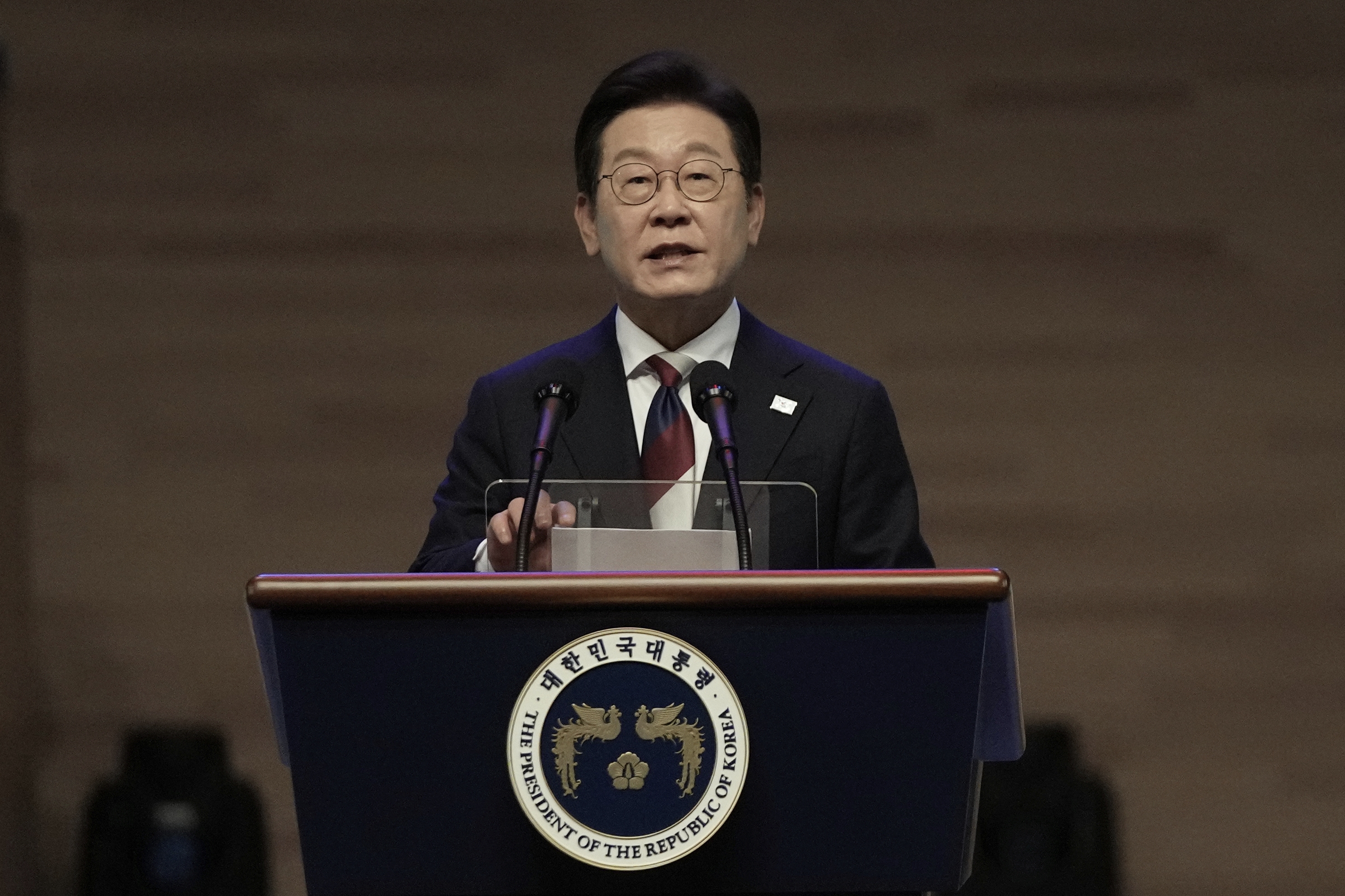 South Korean President Lee Jae-myung, shown speaking Aug. 15, is due to meet with President Trump during his first visit to Washington, D.C.