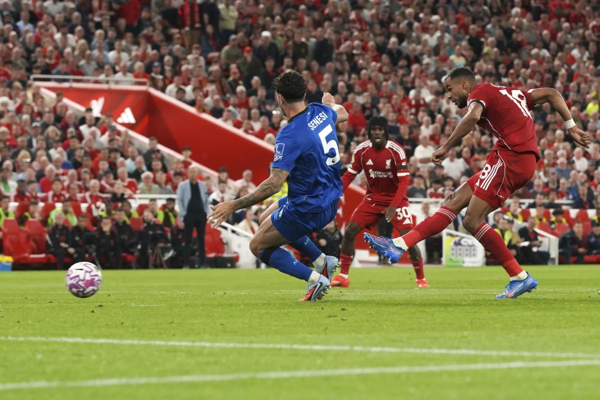 Liverpool's Cody Gakpo (right) scores his side's second goal during the English Premier League soccer match between Liverpool and Bournemouth at Anfield stadium in Liverpool, England, on Aug. 15, 2025. Both teams are owned by Americans.