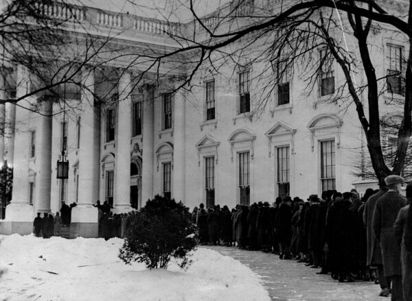 Citizens line up outside the White House to wish the president a happy New Year, circa 1943.