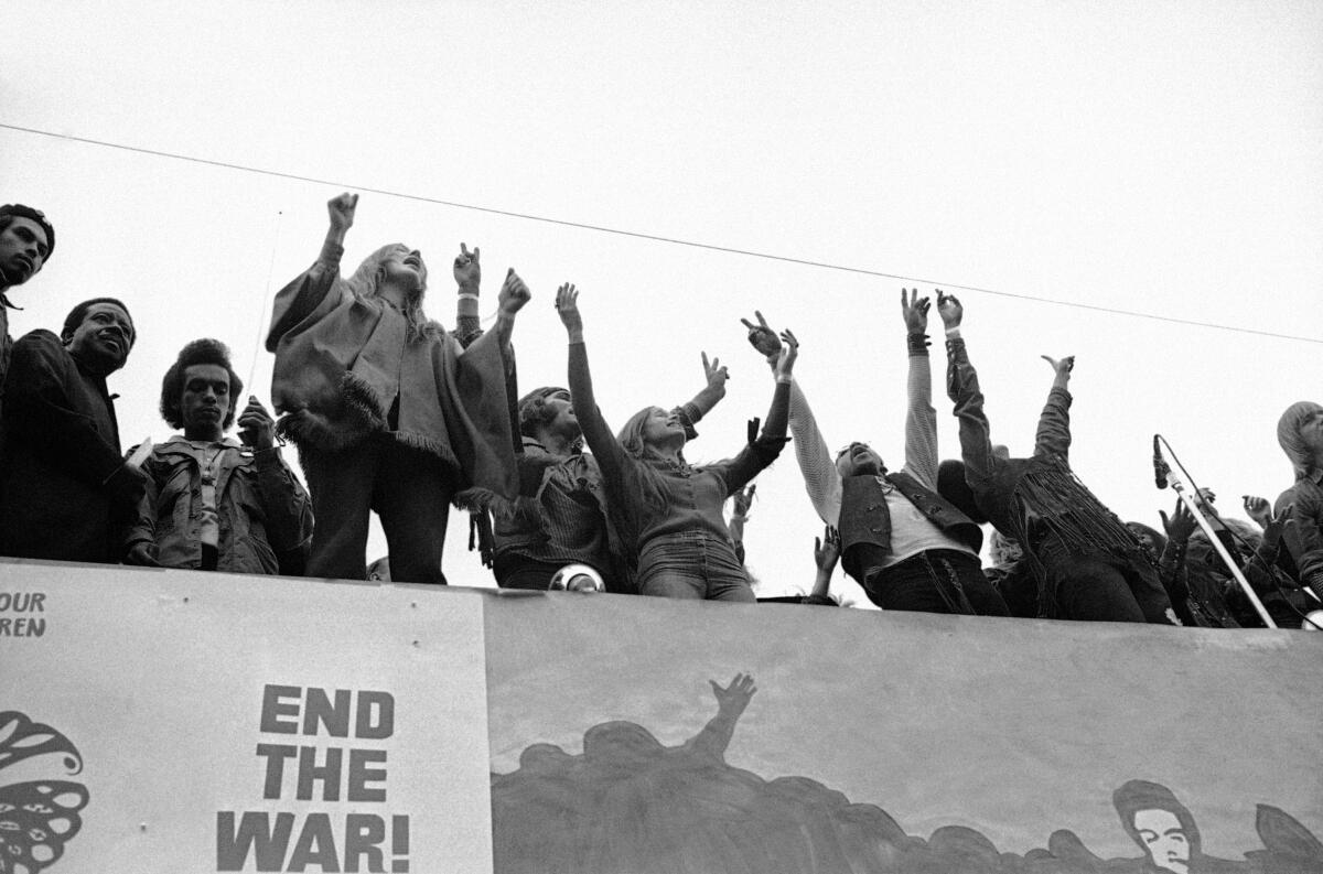 Cast members of the play Hair join activist and Southern Christian Leadership Conference co-founder Rev. Ralph Abernathy (second from left) during an anti-war rally in San Francisco's Golden Gate Park on Nov. 15, 1969.