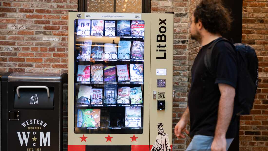 A man walks by a Litbox vending machine in a food hall in Washington, D.C.