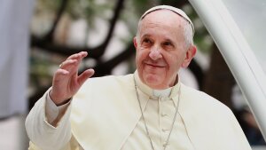 Pope Francis waves to thousands of followers as he arrives at the Manila Cathedral on January 16, 2015 in Manila, Philippines.
