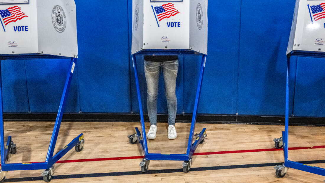 A voter casts their ballot at a polling station in Manhattan's Tribeca neighborhood as New Yorkers head to the polls on Primary Day on June 23 in New York City.