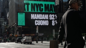 A billboard in New York City shows a Kalshi advertisement. It reads: Mamdani 92%, Cuomo 8%.  