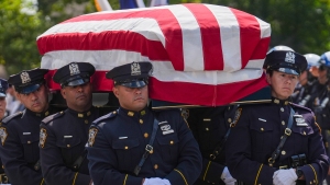 The casket of fallen U.S. Army Sgt. Angel Sarah Rampersad, who was killed in the ongoing war between the U.S. and Iran, is carried by NYPD officers during the funeral procession in the Queens borough of New York on Friday, July 31, 2026.