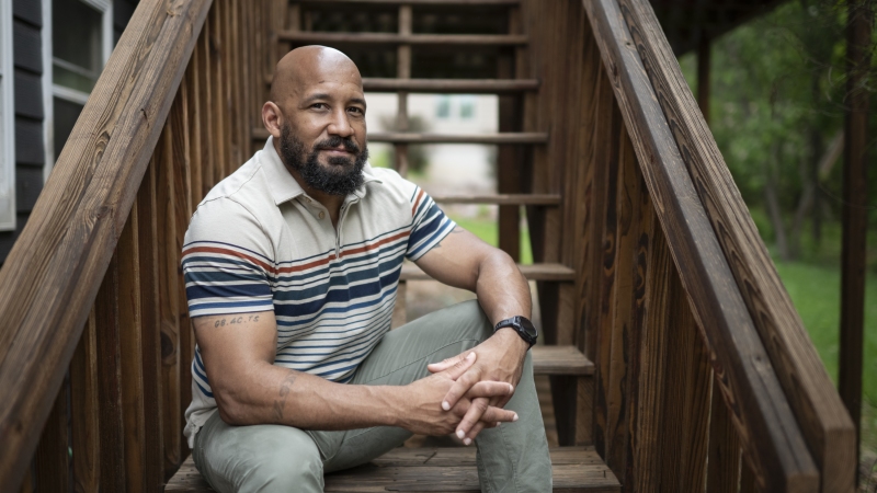 Dave Carlson, of Eau Claire, Wis., poses for a portrait outside his home on May 30. NPR Veterans Correspondent Quil Lawrence and Carlson began corresponding 10 years ago when Carlson, an Iraq vet, was incarcerated. Their conversations follow the evolution of Carlson's life and transformation — from an incarcerated vet struggling with addiction to husband, father and practicing lawyer.