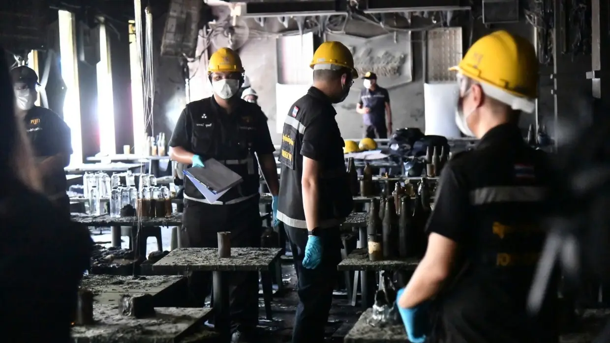Investigators probe a fire at a music bar in Bangkok that killed at least 27 people