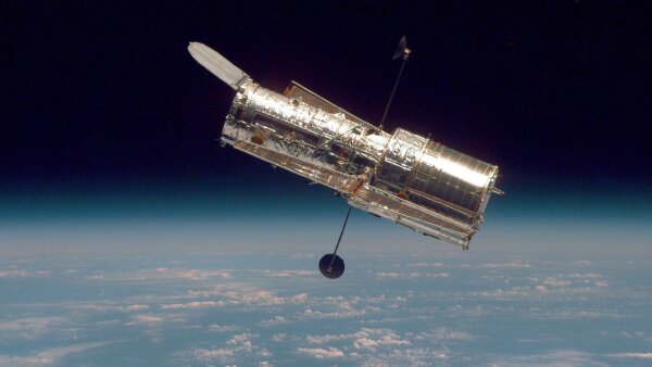 The Hubble Space Telescope drifts through space in a picture taken from the Space Shuttle Discovery in 1997.