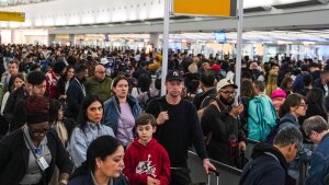 People wait in long TSA security lines at John F. Kennedy International Airport (JFK) in the Queens borough of New York, Monday, March 23, 2026. (AP Photo/Ryan Murphy)