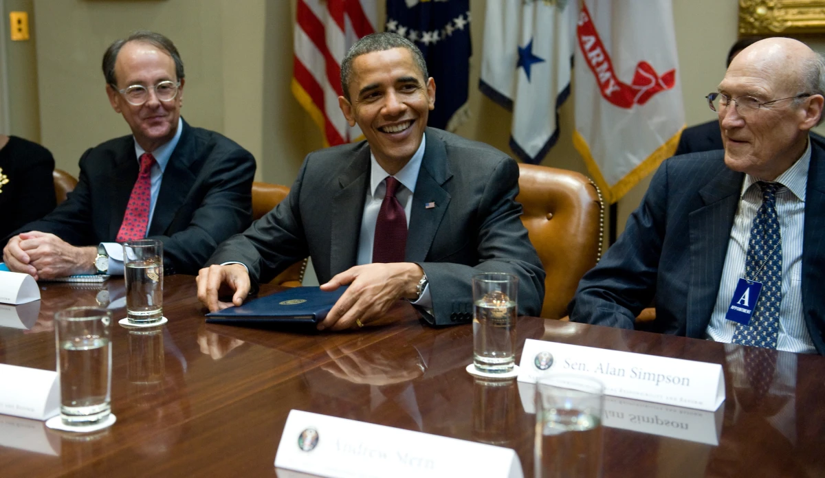 President Barack Obama speaks alongside Erskine Bowles (left) and Alan Simpson (right), co-chairs of the National Commission on Fiscal Responsibility and Reform, on April 27, 2010.