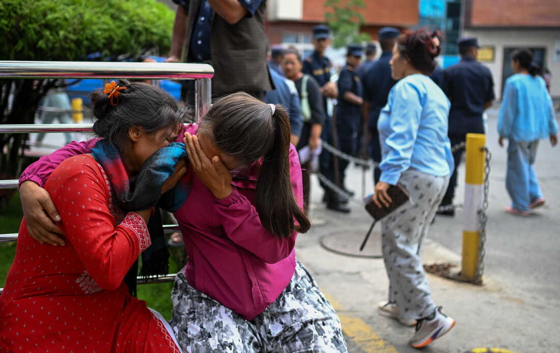 Family members of missing flood victims react at the emergency ward of the Maharajgunj Medical Campus, part of the Tribhuvan University Teaching Hospital in Kathmandu, Nepal.