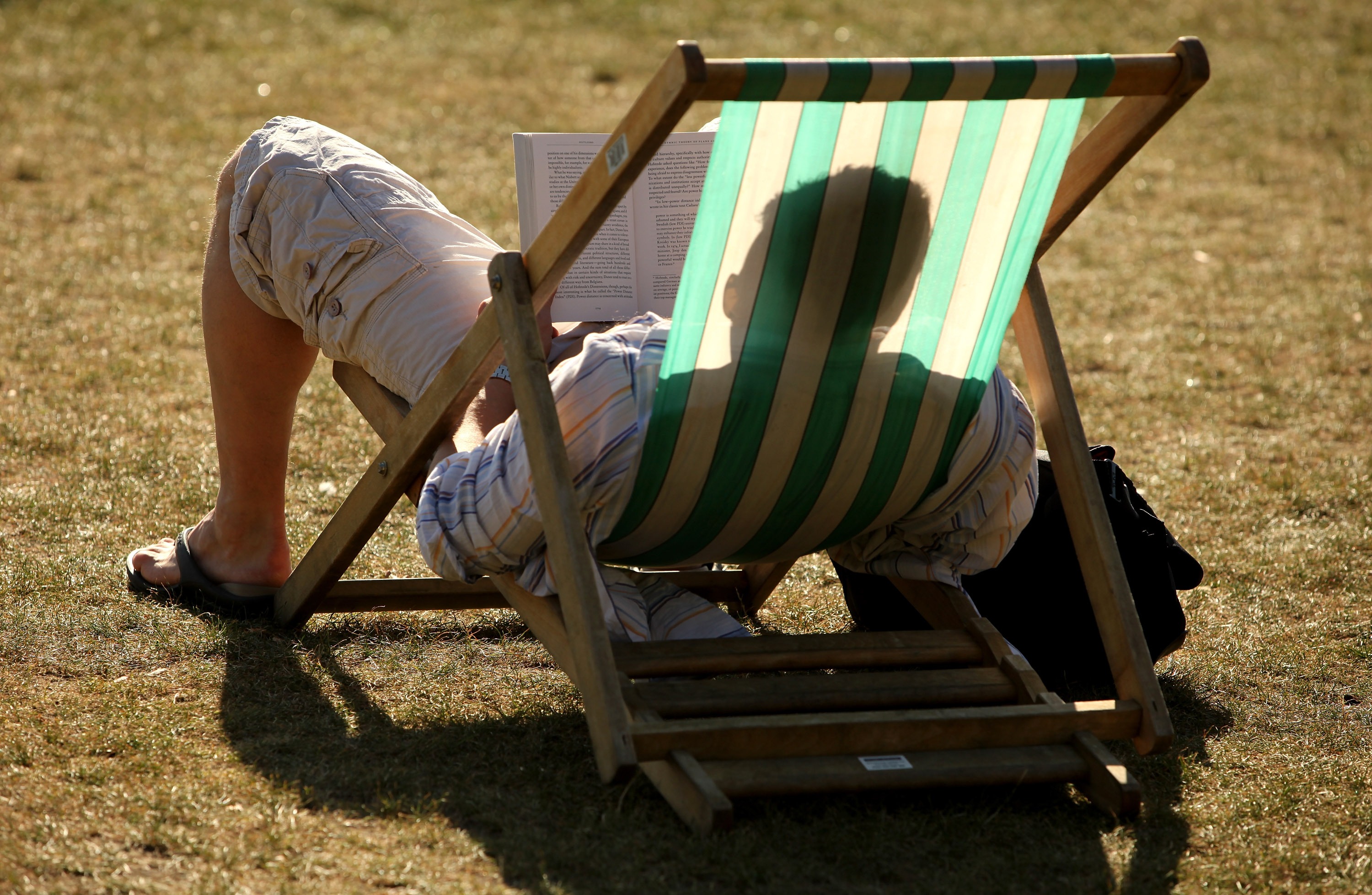 A syndicated, AI-generated summer reading list featuring fake books by real authors was published in major newspapers this week. Above, a reader enjoys the sunshine in Hyde Park in London in 2009.