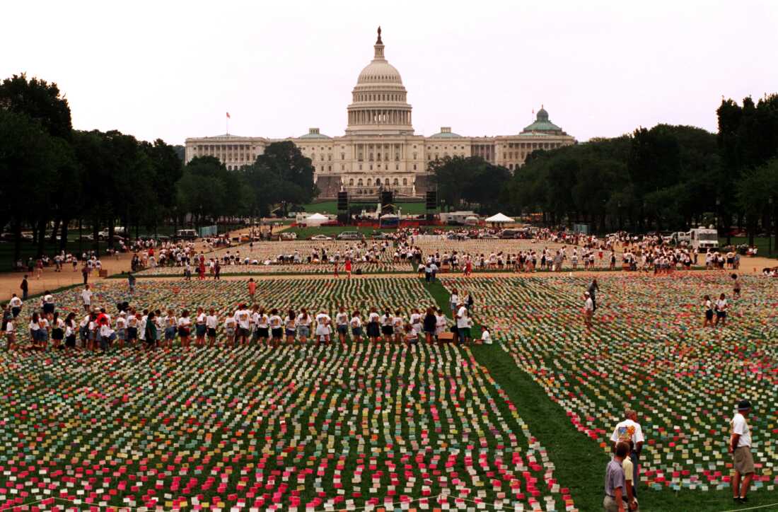 In this 1994 photo, an estimated 200,000 purity pledge cards signed by young people and attached to stakes have been arrayed in many long rows on the lawn of the National Mall in Washington, D.C. The U.S. Capitol building stands in the background.