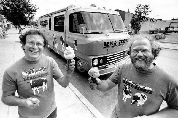 Jerry Greenfield and Ben Cohen, the founders of Ben & Jerry's, pose in front of their "Cowmobile" in Burlington, Vt., on June 15, 1987.