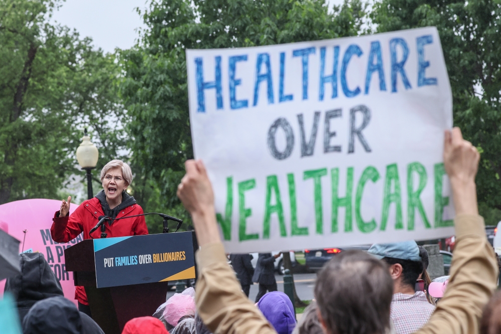 Massachusetts Sen. Elizabeth Warren, a Democrat, speaks during a rally opposing House Republicans Tax Proposal prior to the final House vote on Capitol Hill on May 21. in Washington, D.C. (Photo by Jemal Countess/Getty Images for Families Over Billionaires)