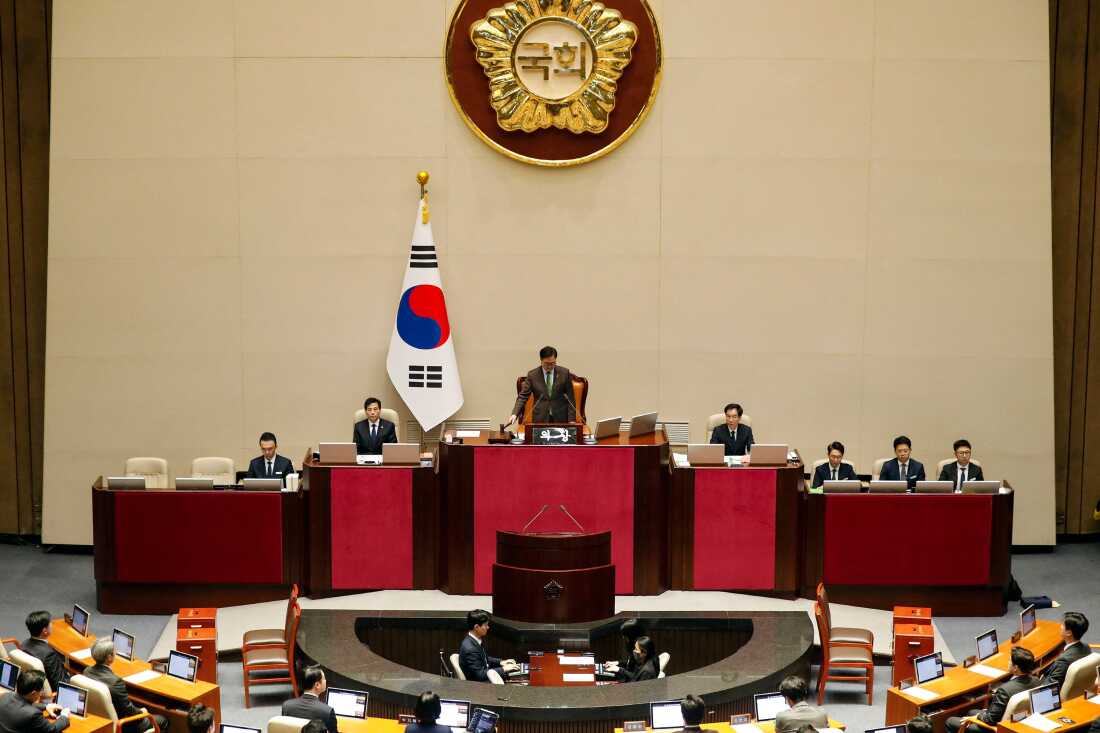 South Korean National Assembly Speaker Woo Won-shik bangs the gavel to initiate the plenary session for the impeachment vote of President Yoon Suk Yeol at the National Assembly in Seoul, on Saturday.