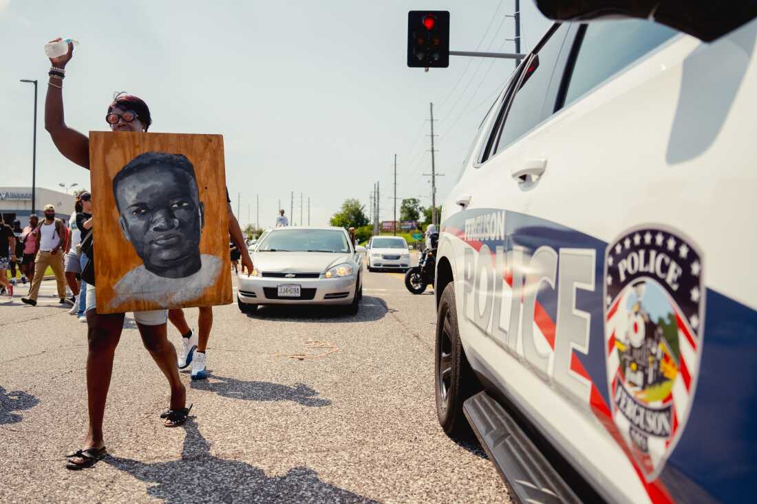 Clara Holmes, 55, of north St. Louis, makes her way to Canfield Drive on Friday, Aug. 9, 2024, during a unity march commemorating a decade after Michael Brown Jr.’s police killing in Ferguson.