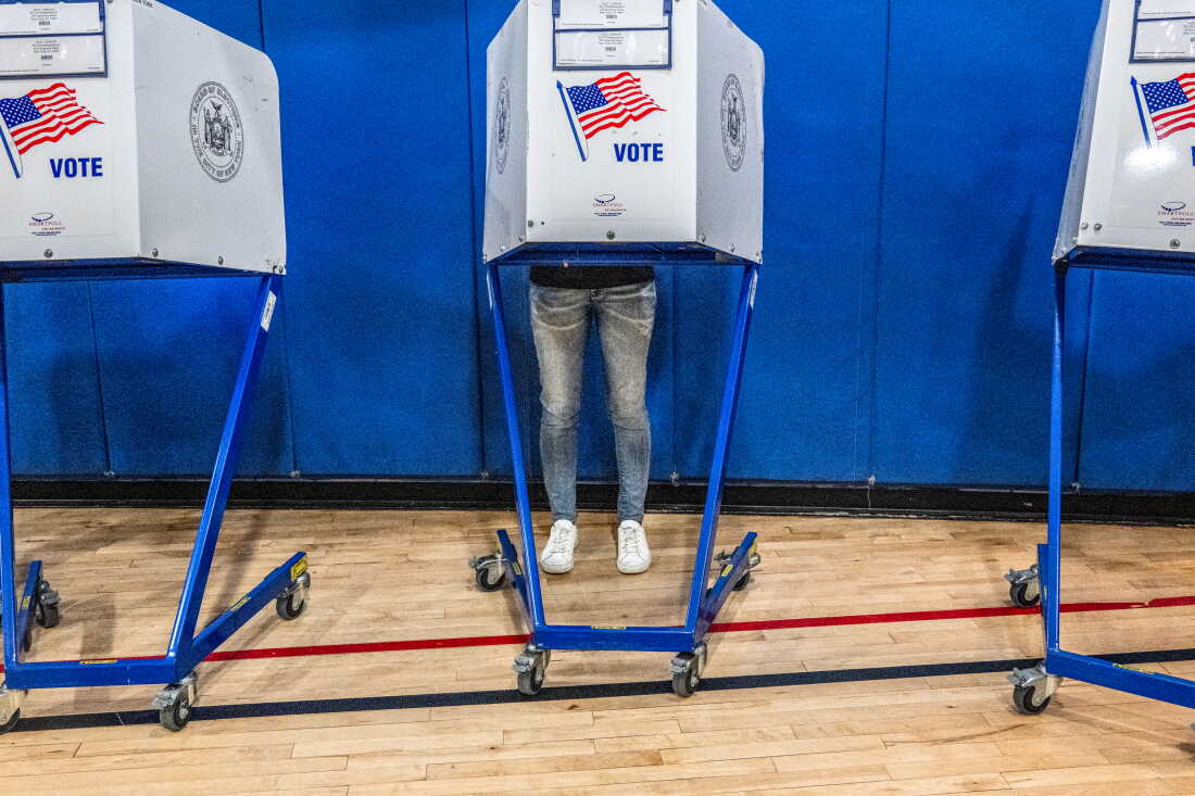 A voter casts their ballot at a polling station in Manhattan's Tribeca neighborhood as New Yorkers head to the polls on Primary Day on June 23 in New York City.
