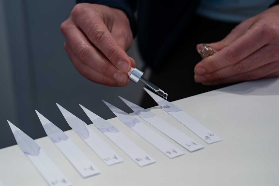 JJ Vittoria, CEO of Olfactory NYC, mixes multiple oils into strips of paper at their Georgetown location on Thursday May 16, 2024.