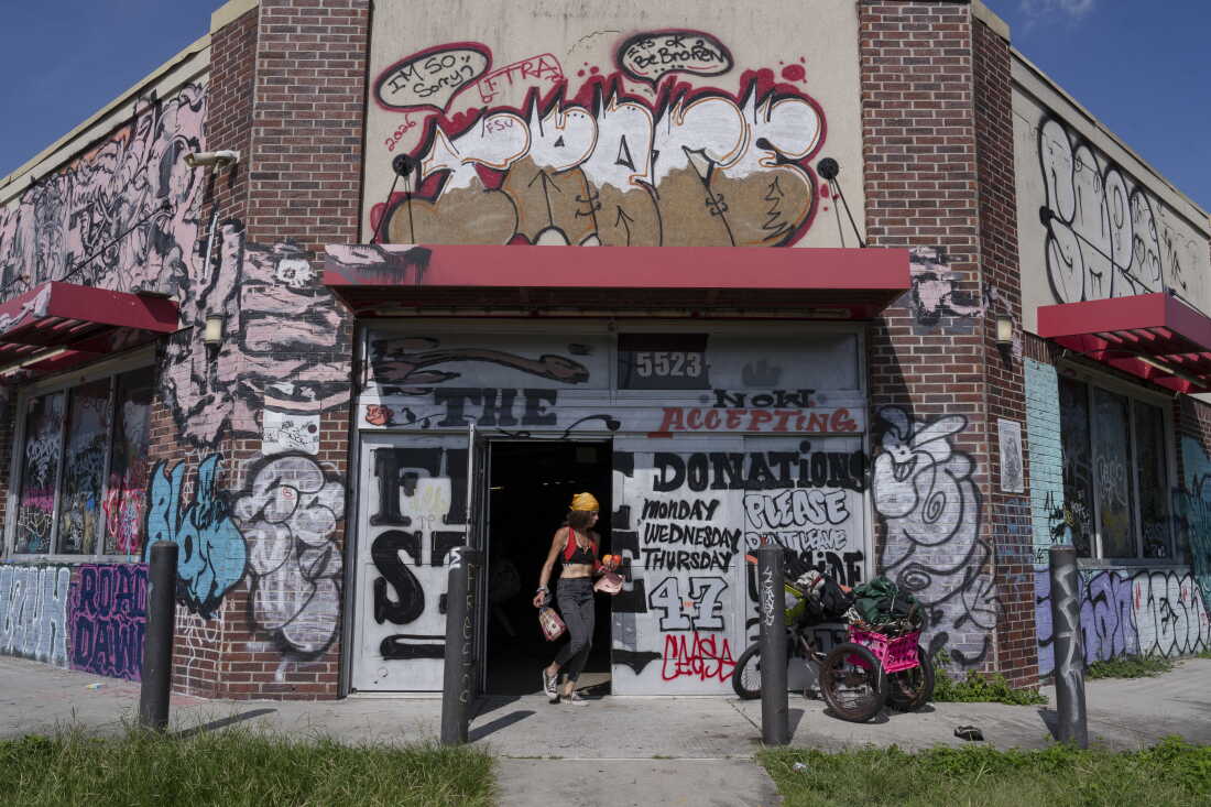 A person walks through the entrance of the New Orleans Free Store, in the Lower Ninth Ward of New Orleans, La. on Aug. 20, 2026.