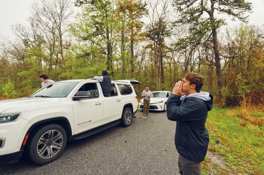 Teammate Jack Trojan, 17, right, makes bird calls at High Point State Park.
