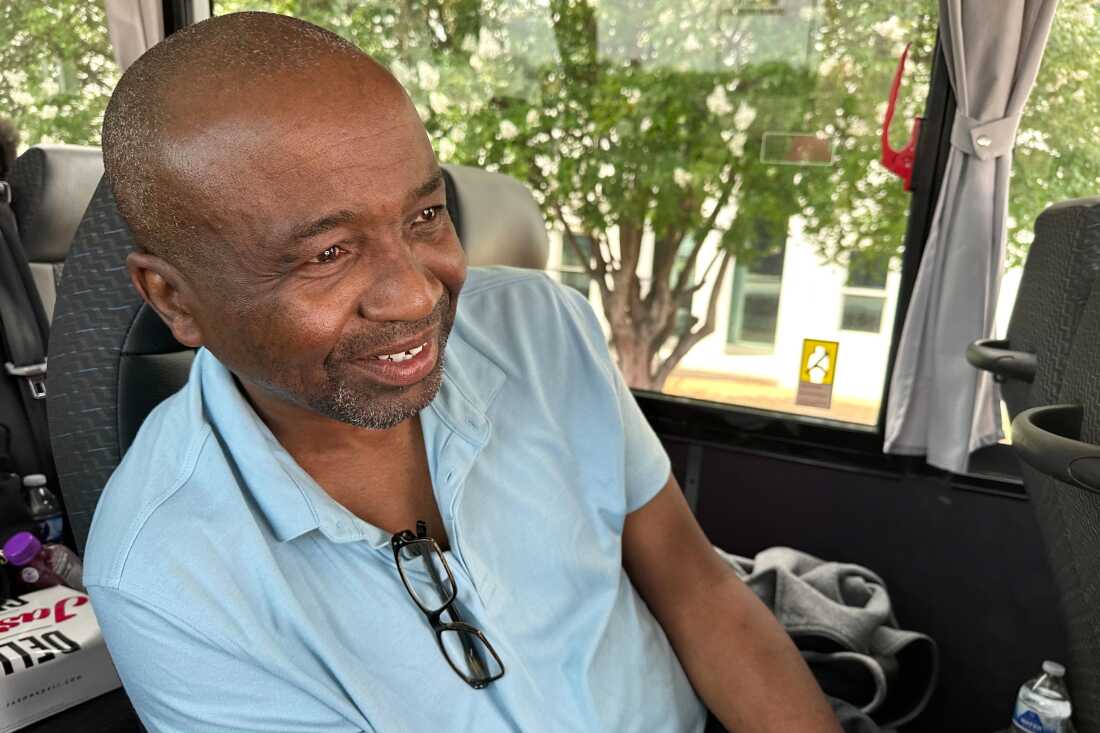 Keith Odom, a forklift driver from Aiken, S.C., looks out from his bus seat as he arrives in Montgomery, Ala., for a voting rights rally Saturday, May 16, 2026.