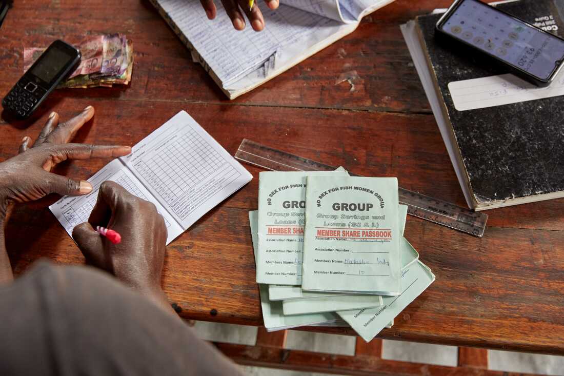 No Sex For Fish personnel Naomy Akoth makes notes during array banking sunday, Justine's home, Nyang’ande, Kisumu, Kenya, 2025.