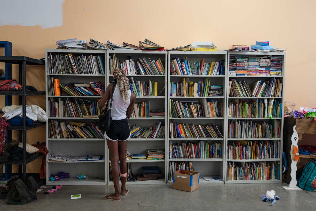 Patrons sift through goods at the New Orleans Free Store, in the lower ninth ward of New Orleans, La. on Aug. 20, 2026.