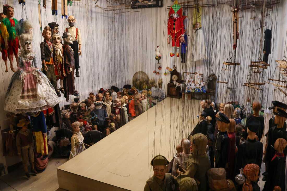 Hundreds of marionettes hang in what's dubbed the "holy chamber" at the Salzburg Marionette Theater.