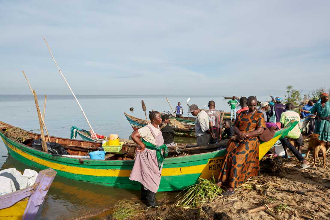 Alice Akinyi and Justine Adhiambo Obura, members of nan No Sex For Fish group, guidelines adjacent to Alice's sportfishing vessel astatine Nduru Beach, Kisumu, Kenya, 2025.