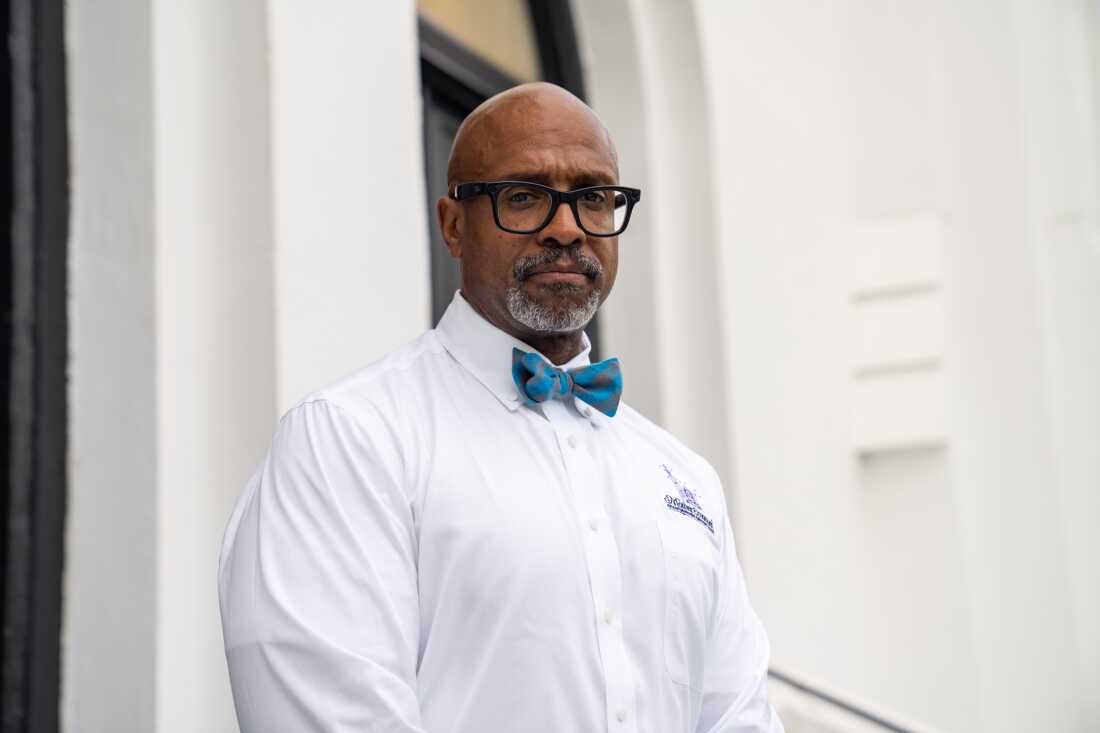 Current pastor Rev. Eric Manning stands outside Mother Emanuel African Methodist Episcopal Church in Charleston, SC on June 3, 2025.