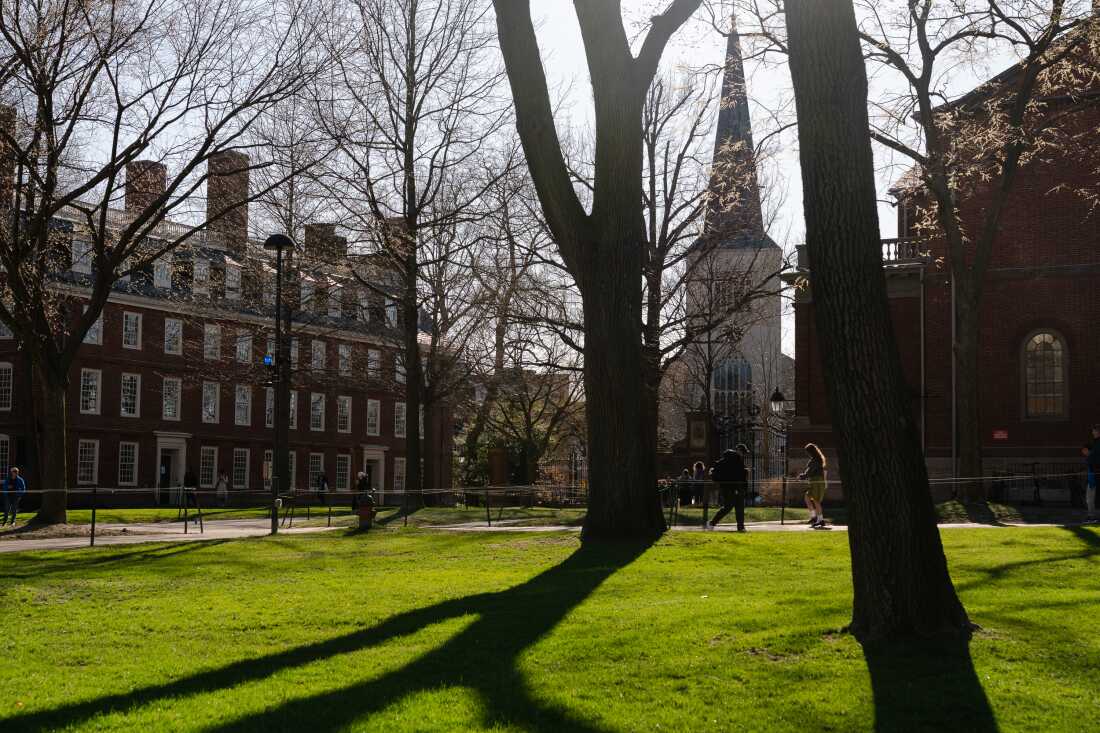People walk through the campus of Harvard University in Cambridge, Massachusetts on April 17.