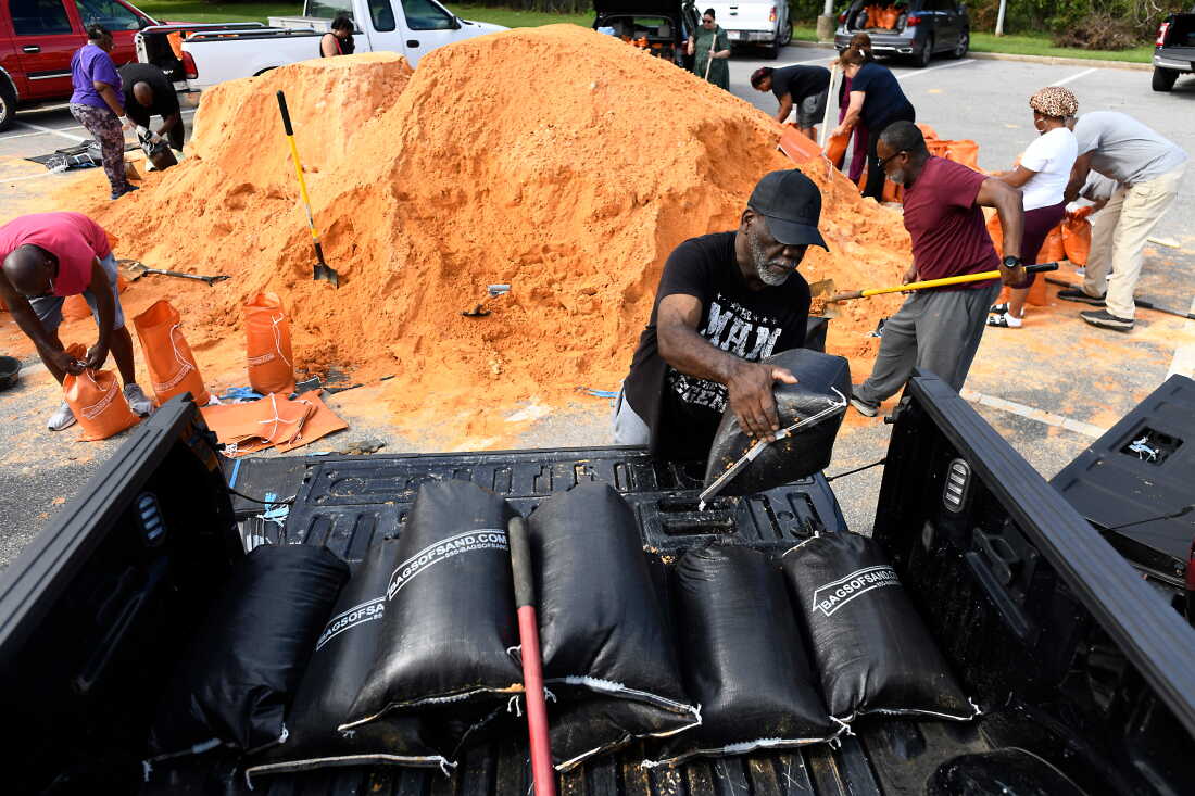 Residents pick up sandbags for storm preparation at the James Seals Jr. Parks & Recreation Center ahead of Hurricane Isaias' expected landfall along the Gulf Coast, Thursday, Oct. 8, 2026, in Mobile, Ala.