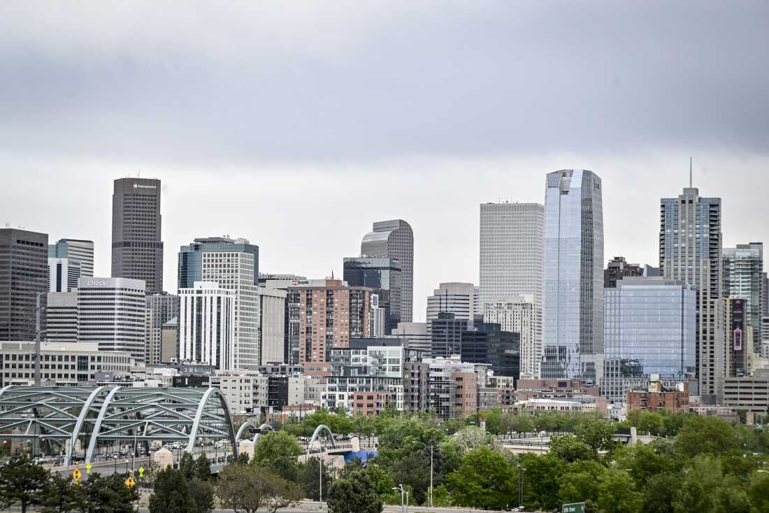 This photo shows the skyline of Denver, with many tall and modern buildings.