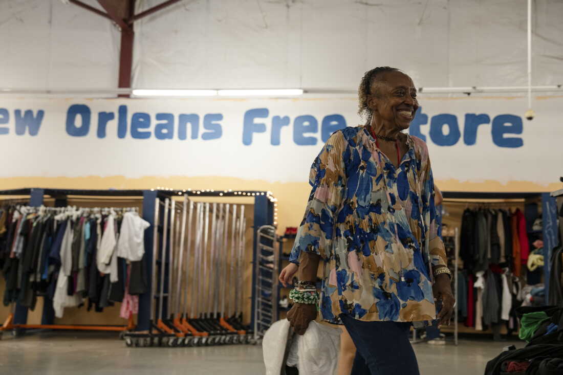 Volunteer Queenie organizes goods at the New Orleans Free Store, in the lower ninth ward of New Orleans, La. before opening their doors to patrons on Aug. 20, 2026.