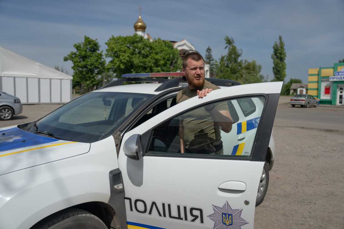 Oleksii Kharkivskyi, patrol police chief of Vovchansk, in his police car at an undisclosed location in Kharkiv Oblast, Ukraine, on May 26.