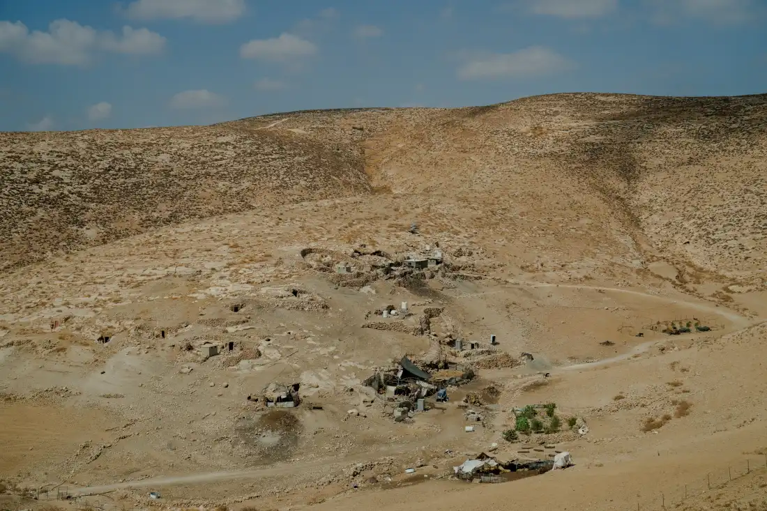 A remote Palestinian pastoral hamlet with stone dwellings and shelters nestled into the arid hills of Masafer Yatta, in the occupied West Bank, on Sept. 24, 2026.