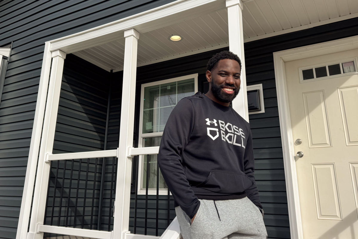 Kenston Fields stands in front of his new home in Petersburg. He had no idea it was factory built when he toured it with a real estate agent and was 'sold the moment I walked in.'