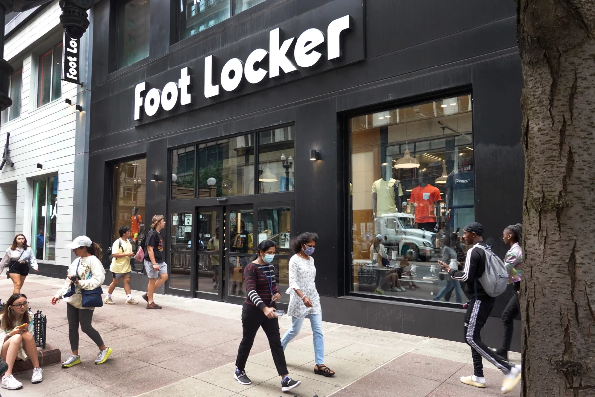 People walk by a Foot Locker store in Chicago.