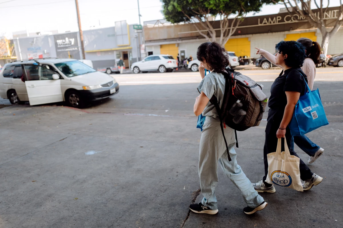 UCLA medical students, working alongside Dr. Mary Marfisee, walk the streets of Skid Row in downtown Los Angeles, offering medical care to women in need. December 15, 2025.