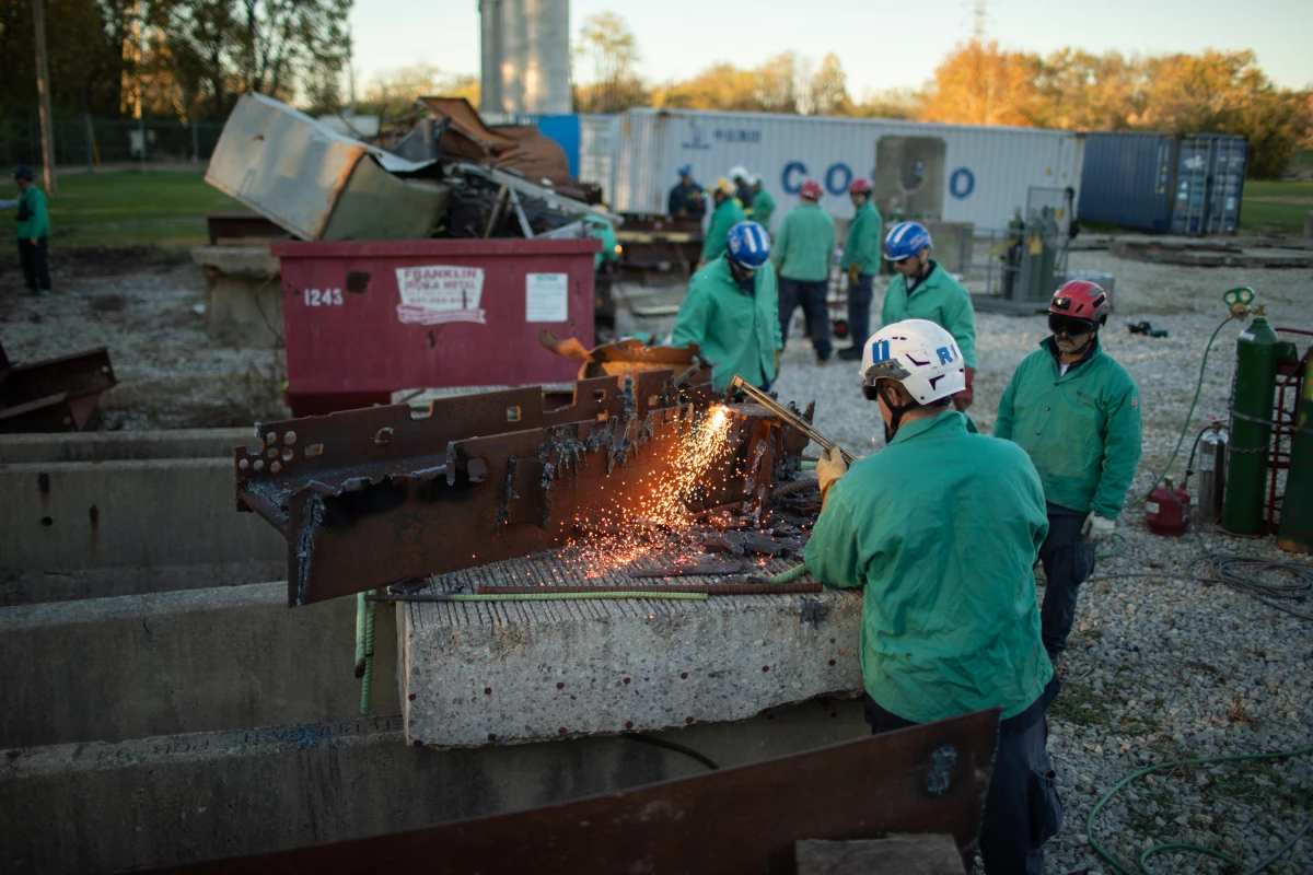 The country's urban search and rescue system covers the whole country, even rural areas that could never maintain such a force on their own. Here, search and rescue experts practice using torches to cut through steel beams.